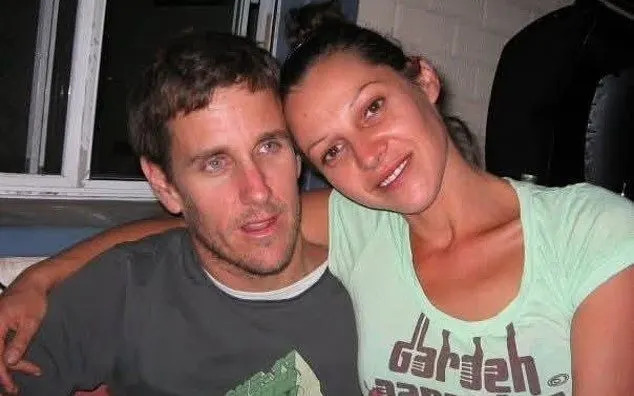 Floral tributes and messages left by community members outside a Mosman Park home.