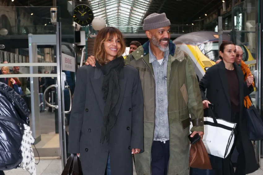 Halle Berry smiling as she shows her engagement ring after confirming her engagement to musician Van Hunt.