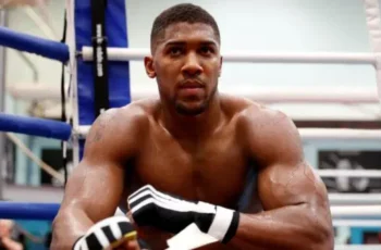 Anthony Joshua receiving treatment during rehabilitation following car crash injuries.