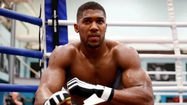 Anthony Joshua receiving treatment during rehabilitation following car crash injuries.
