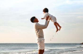Father's Day 2026: Why Fathers Matter More Than Ever In Today's World Family celebrating Father's Day 2026 with their father