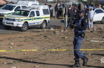 Fear Grips Johannesburg Settlement After Gunmen Kill 12 in Late-Night Attack Police and emergency responders at the scene of a deadly shooting in Johannesburg.