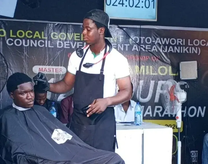 Ikechukwu Damilola during his Guinness World Record haircut marathon attempt in Lagos.