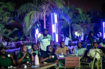 "Nobody Wants To Stay Out Late Again" — How Insecurity Is Quietly Destroying Nigeria's Night Economy A busy Nigerian city street at dusk as businesses prepare to close earlier amid growing security concerns.