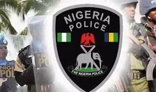 Police officers outside a guest house in Yenagoa, Bayelsa State, during an investigation into the death of a man.