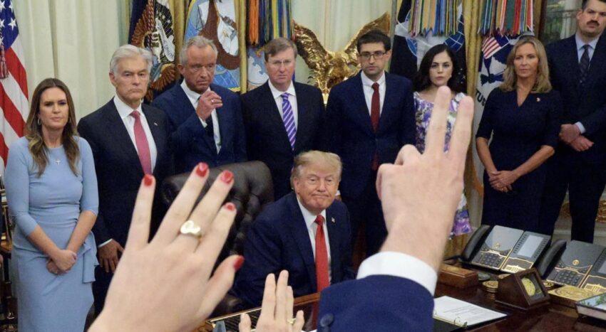 Donald Trump speaks to reporters in the Oval Office after announcing restrictions on CNN, MS NOW and Politico